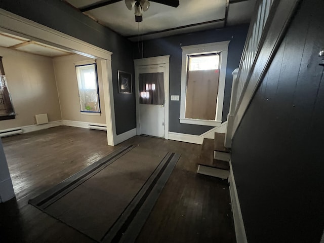 203 Juniper St, Bluefield, WV 24701 - interior space featuring a baseboard heating unit, dark wood-style flooring, baseboards, and a ceiling fan