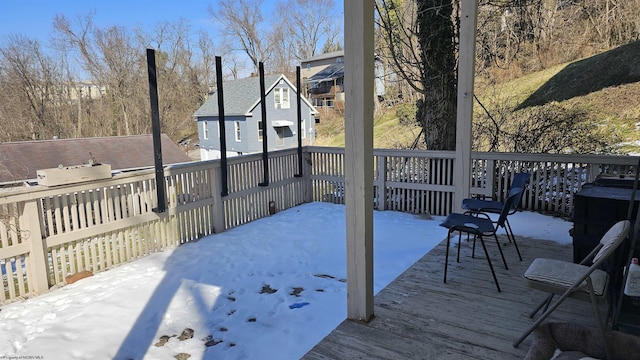 view of snow covered deck