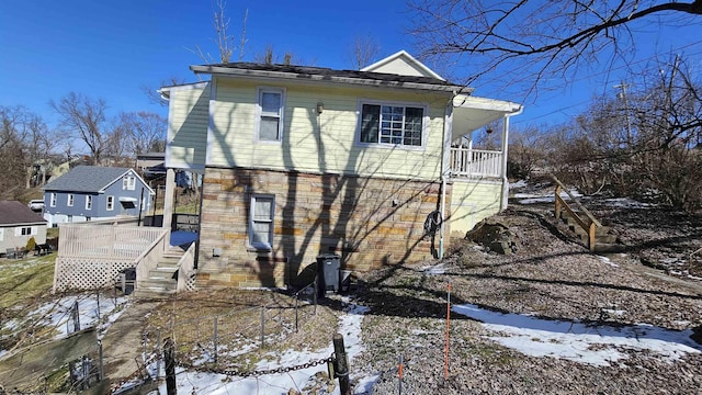 exterior space with stairs and a porch