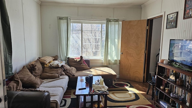 living area with crown molding