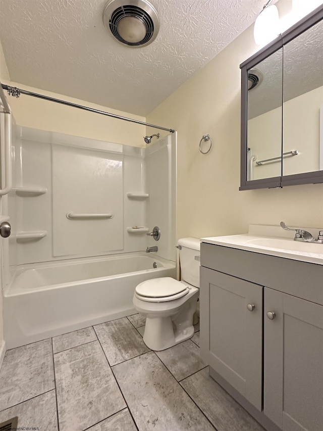 full bath with a textured ceiling, toilet, vanity, visible vents, and tub / shower combination