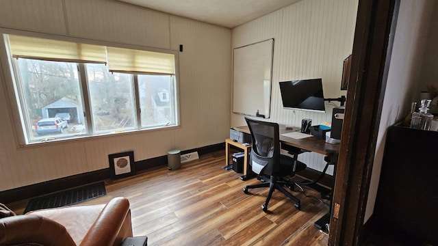 office with visible vents and light wood-style flooring