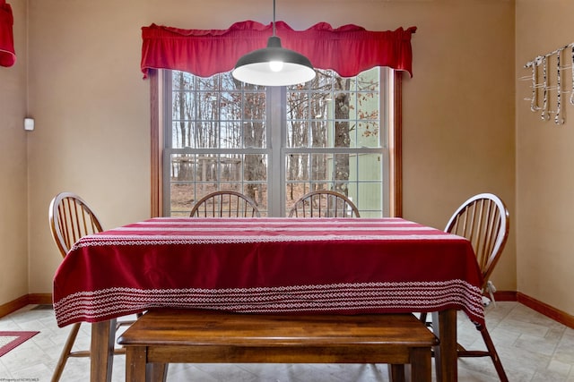 dining room featuring baseboards