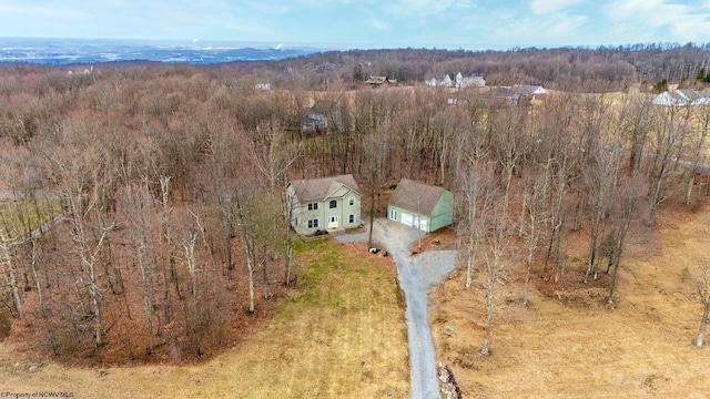 aerial view featuring a wooded view