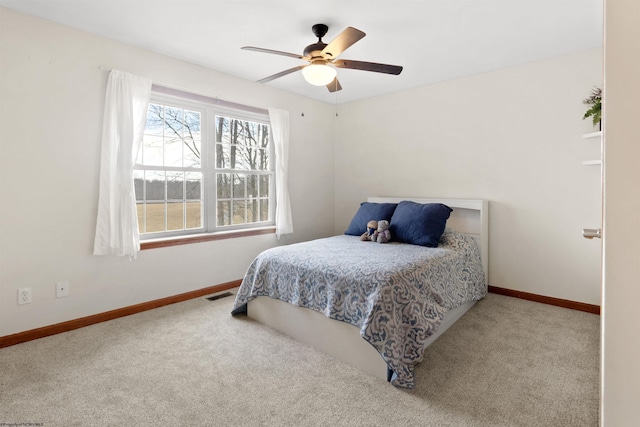 bedroom with carpet flooring, visible vents, and baseboards