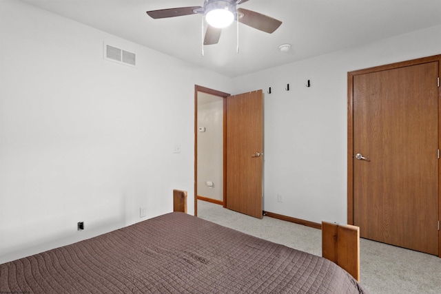 unfurnished bedroom featuring a ceiling fan, carpet, visible vents, and baseboards