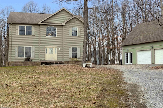 view of front of house featuring a garage, french doors, and a shingled roof