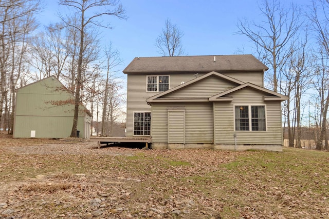 back of house featuring crawl space and a deck