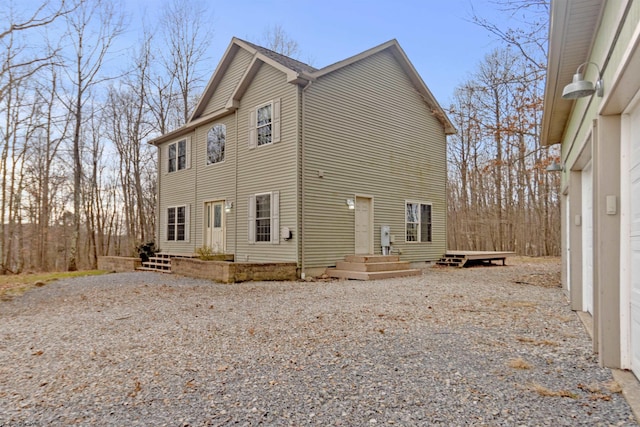 exterior space with gravel driveway