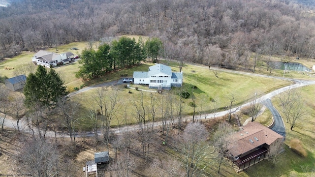 aerial view with a rural view and a wooded view