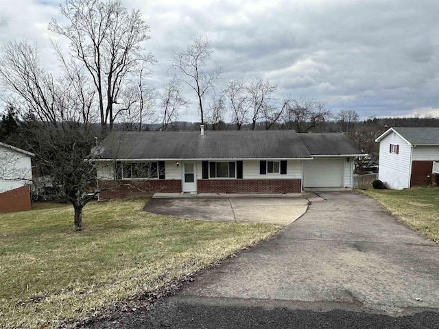 single story home with an attached garage, driveway, a front yard, and brick siding