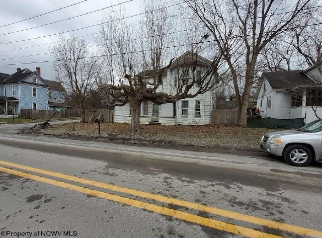 view of front of house featuring fence