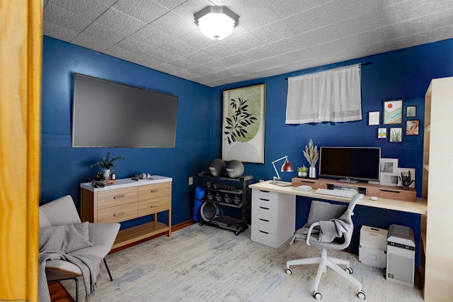 home office with wood finished floors