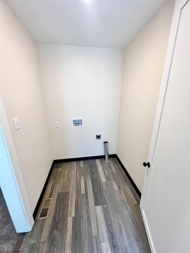 laundry area with washer hookup, visible vents, dark wood-type flooring, laundry area, and baseboards