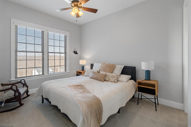 bedroom with carpet flooring, ceiling fan, and baseboards