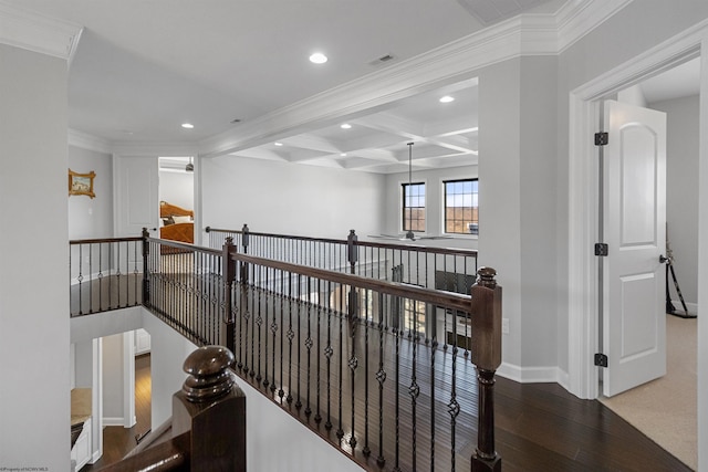 hallway with beam ceiling, crown molding, recessed lighting, wood finished floors, and baseboards