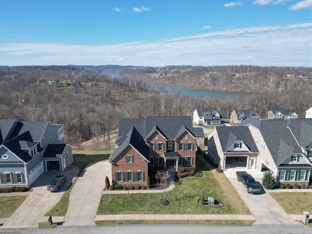 aerial view featuring a water view and a residential view