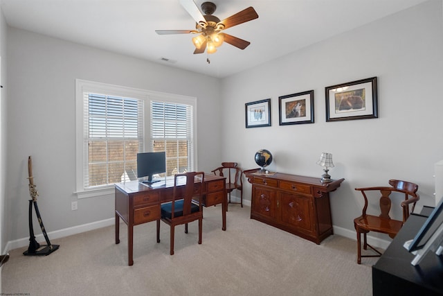 office area featuring light colored carpet, visible vents, ceiling fan, and baseboards