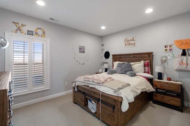 carpeted bedroom featuring visible vents, baseboards, and recessed lighting