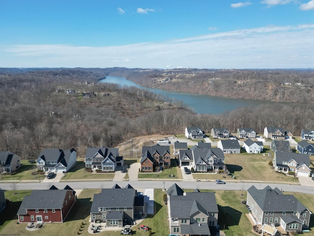 drone / aerial view with a residential view and a water view