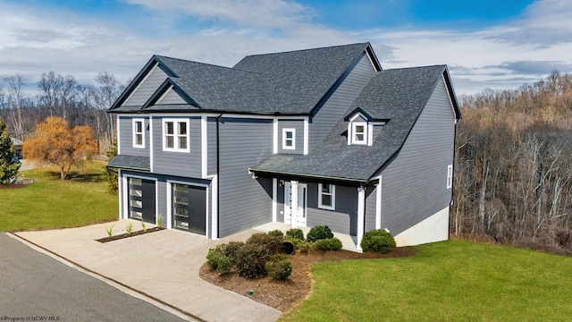 traditional-style house with a garage, a shingled roof, concrete driveway, and a front yard