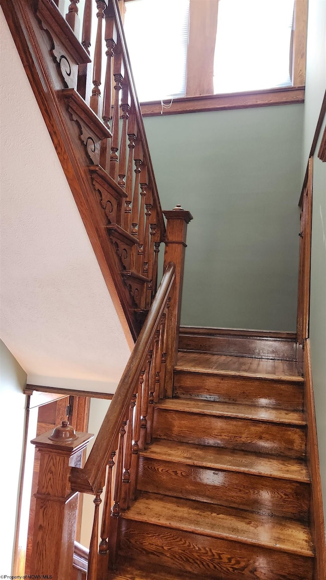 staircase featuring ornate columns