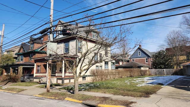 view of front of property with fence