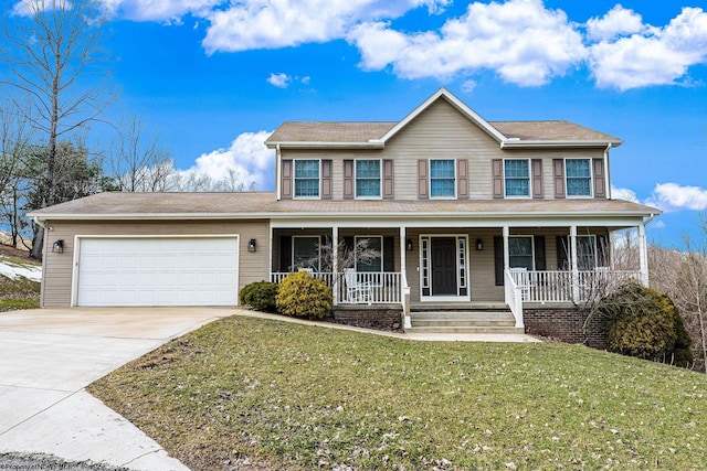 view of front of property with covered porch, driveway, a front lawn, and an attached garage