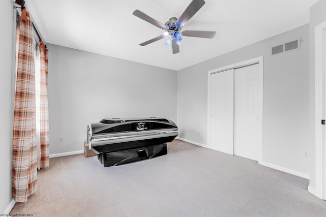 bedroom with carpet, a closet, visible vents, and baseboards