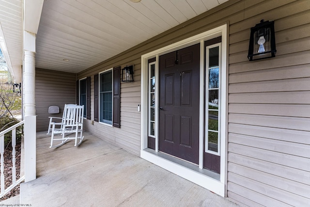 property entrance featuring covered porch