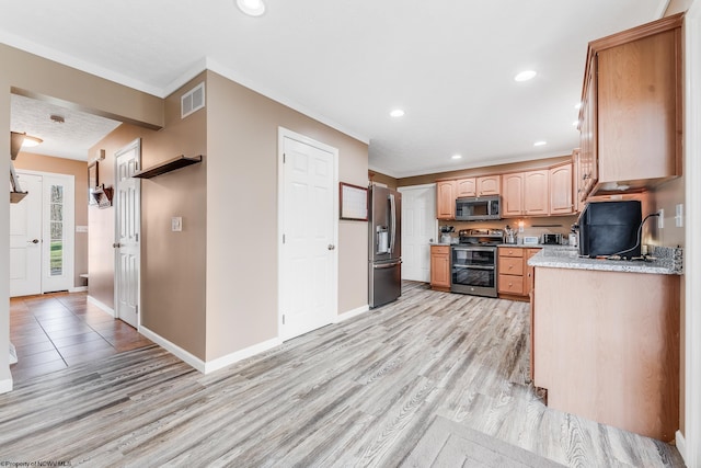 kitchen with visible vents, baseboards, appliances with stainless steel finishes, light wood-type flooring, and recessed lighting