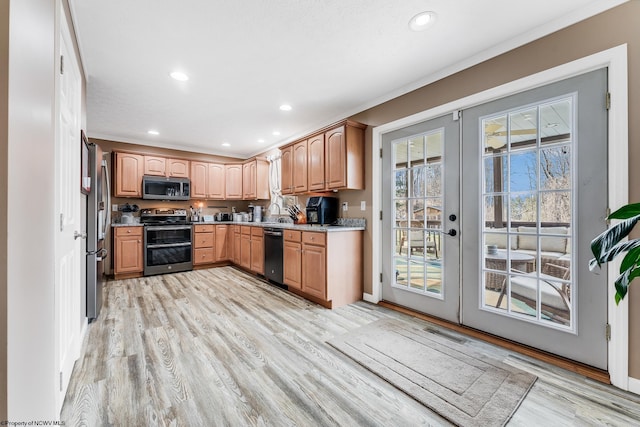 kitchen featuring french doors, stainless steel appliances, recessed lighting, visible vents, and light wood-style floors