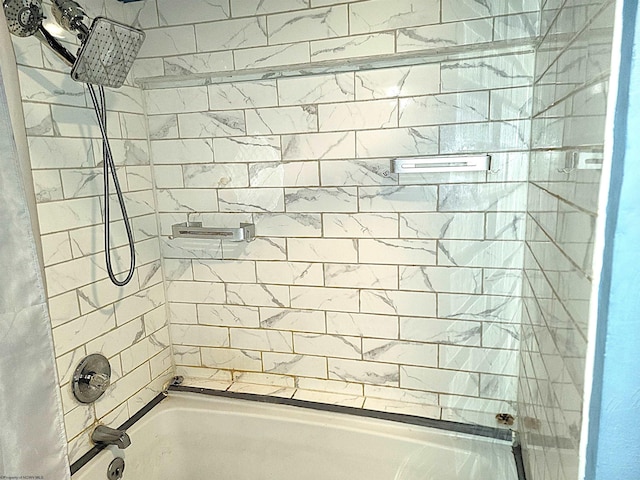 full bath with shower / tub combination