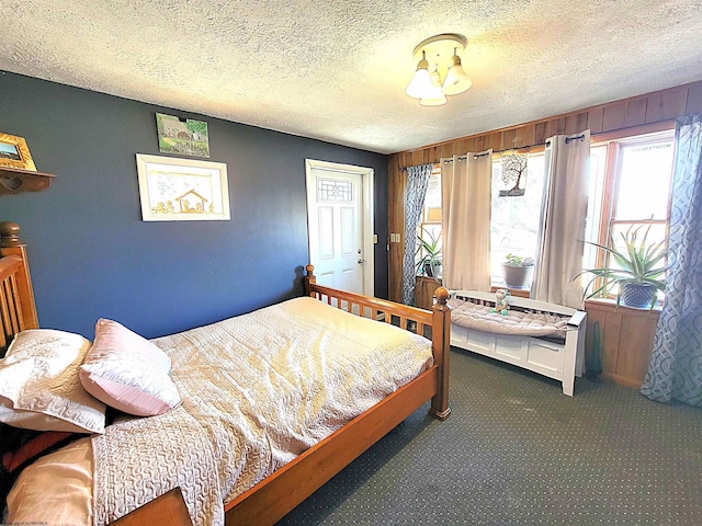 carpeted bedroom with a textured ceiling