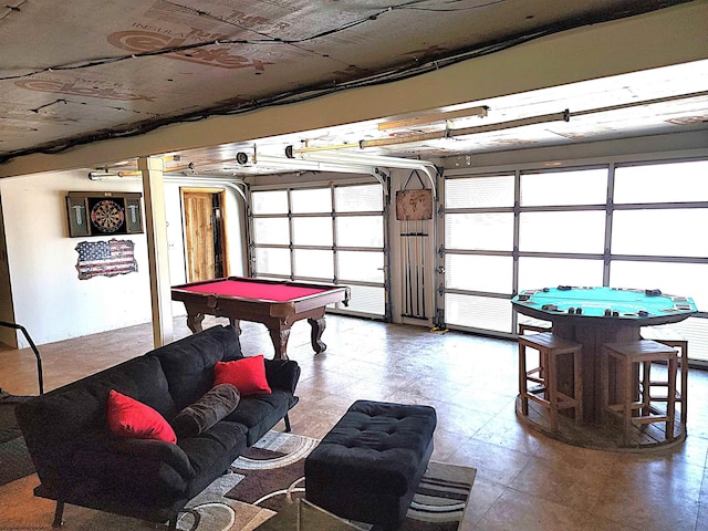 recreation room with a garage and pool table