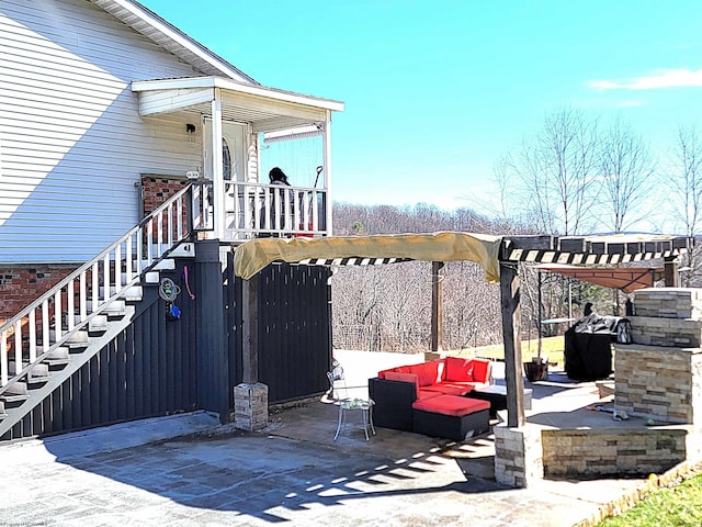 view of patio with stairway, an outdoor living space, and a pergola