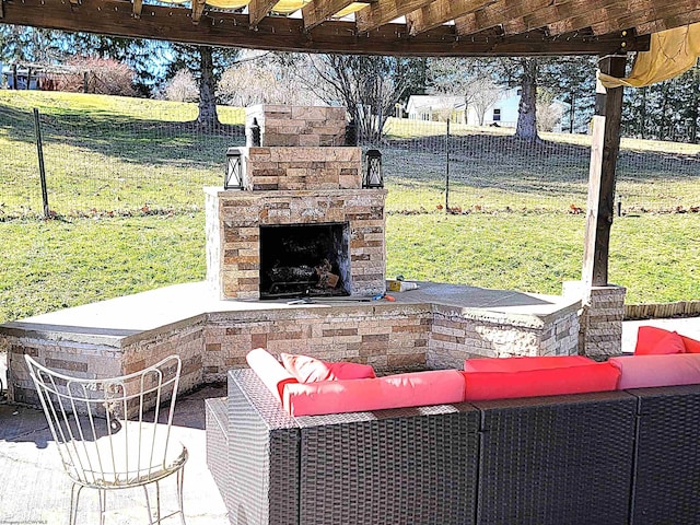 view of patio featuring fence and an outdoor living space with a fireplace