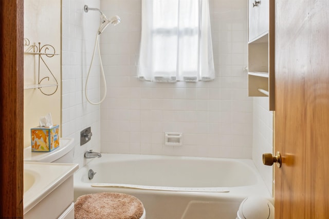 bathroom with shower / bathtub combination, vanity, and toilet