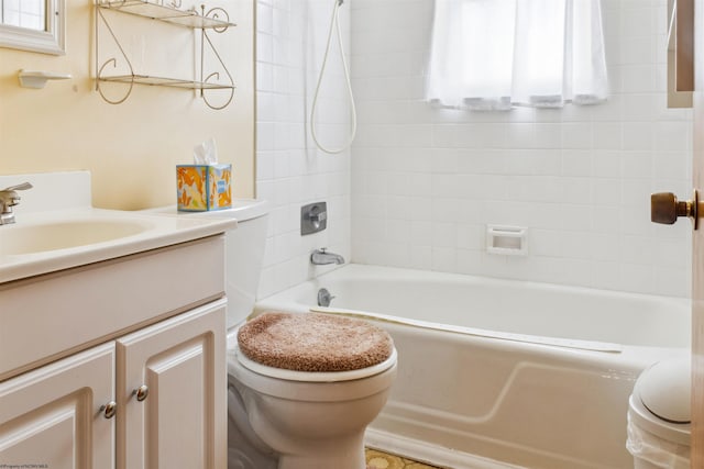 bathroom with  shower combination, vanity, and toilet