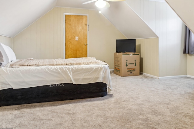 bedroom with lofted ceiling, carpet flooring, ceiling fan, and baseboards