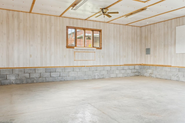 spare room featuring a ceiling fan and concrete floors