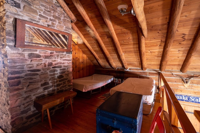 interior space with lofted ceiling with beams, wooden ceiling, and wood-type flooring