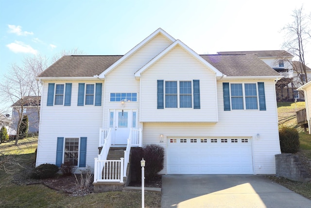 view of front of home featuring concrete driveway, roof with shingles, and an attached garage