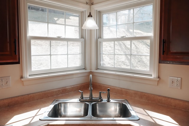 room details with a sink and hanging light fixtures