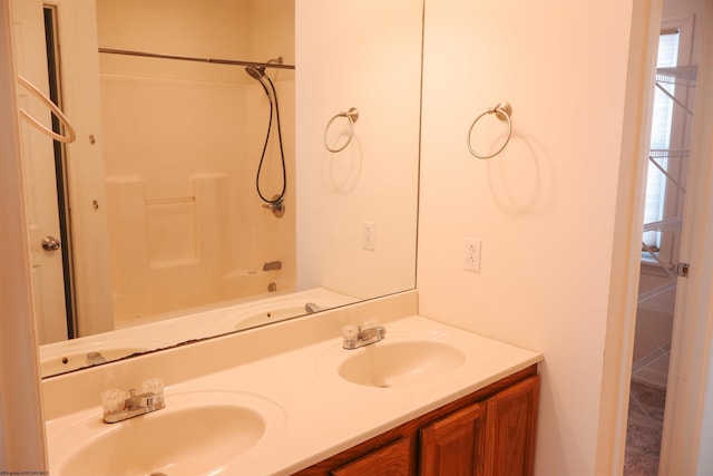 full bath with double vanity and a sink