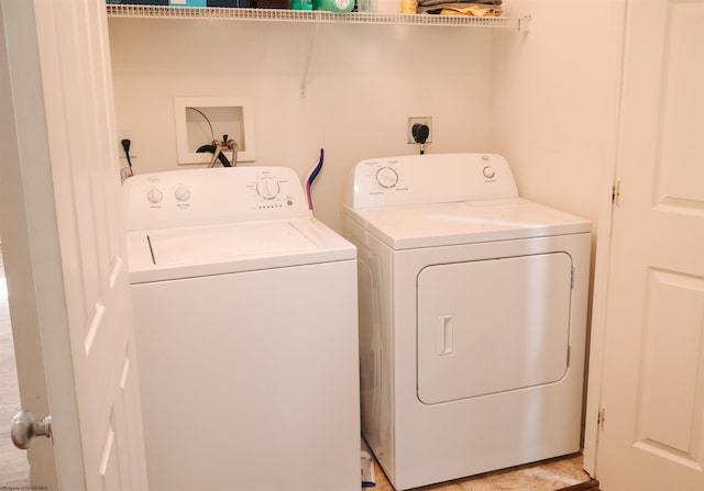 laundry room with laundry area and washing machine and clothes dryer