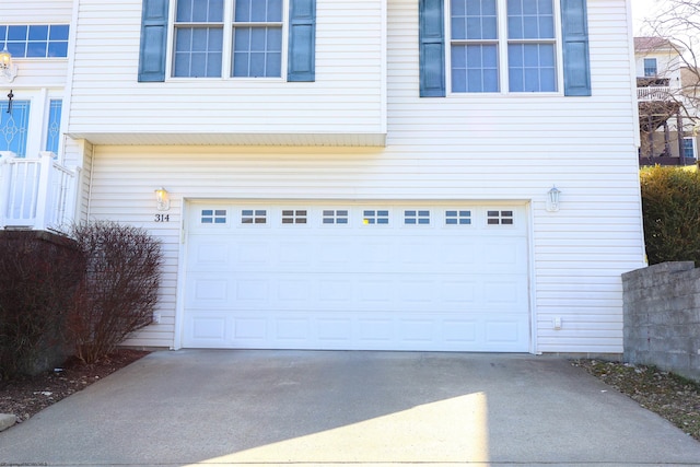 garage featuring driveway