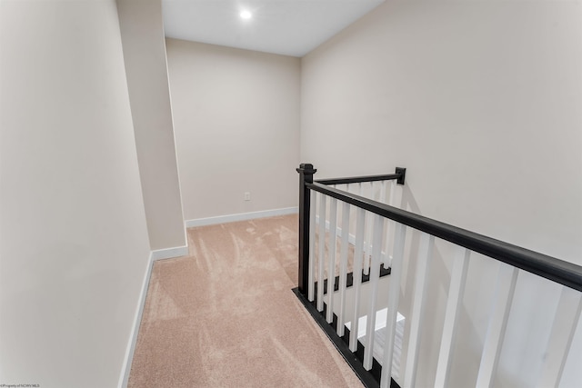 hall featuring light carpet, recessed lighting, an upstairs landing, and baseboards