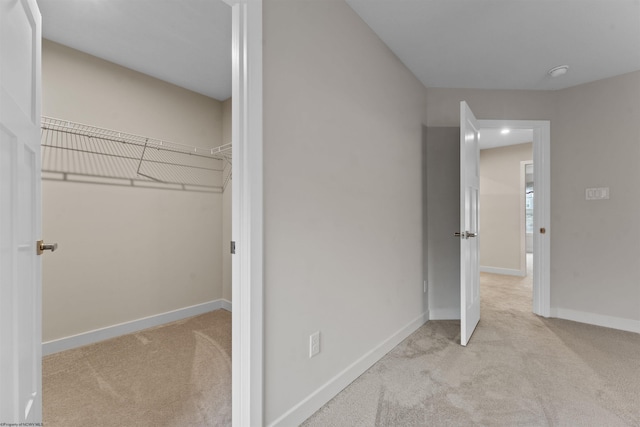 unfurnished bedroom featuring carpet and baseboards