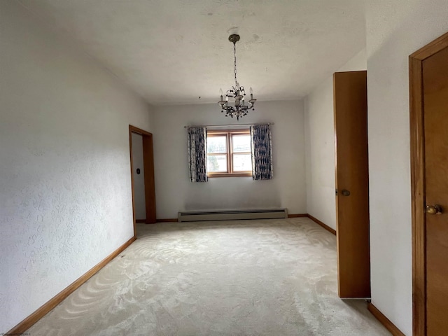 unfurnished dining area with a chandelier, a baseboard radiator, light colored carpet, and baseboards